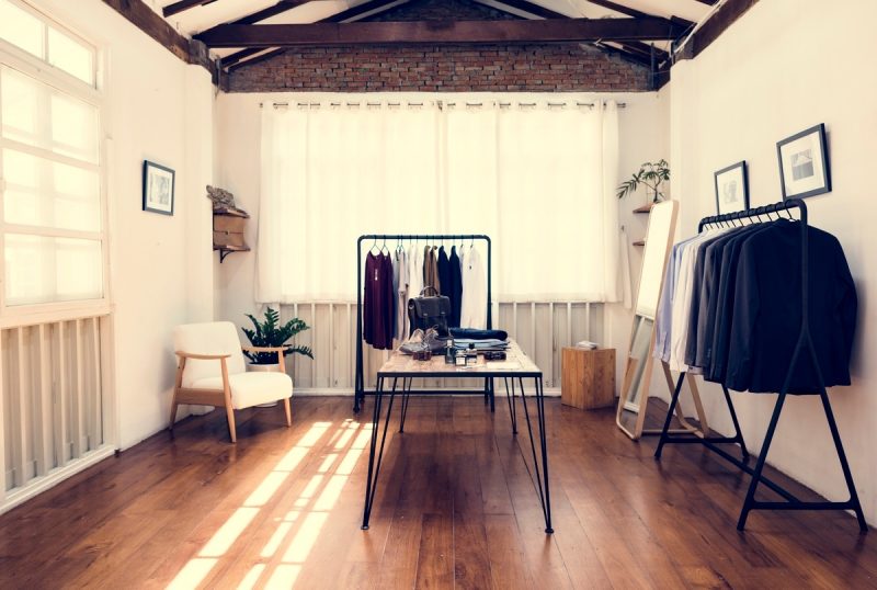 Offline to online retail represented by a sparse clothes shop.