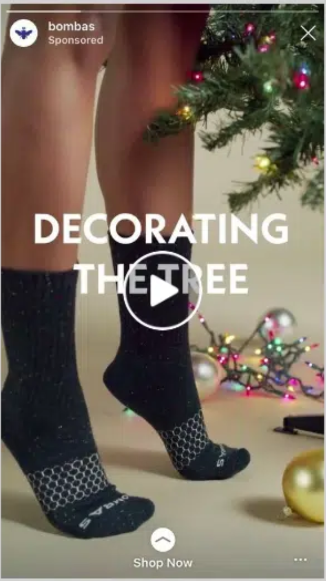 Instagram story ad for bombas with 'sponsored' highlighting it is an ad. 'Shop Now' is the call-to-action, advising the user to swipe up to do so.